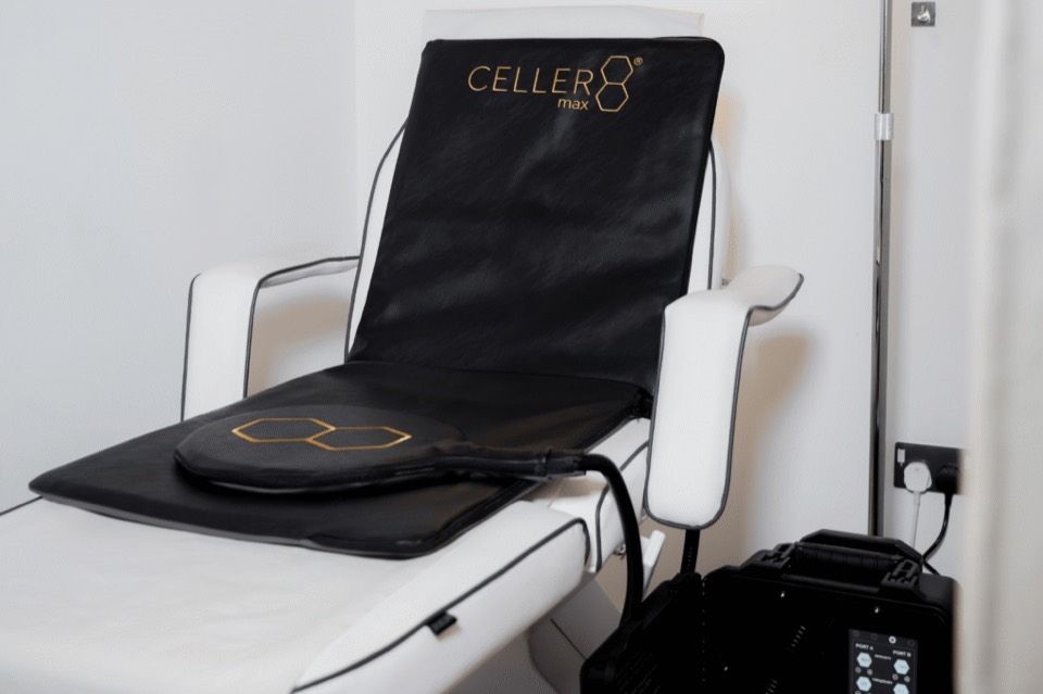 The Cellerate max PEMF mat laid over a treatment couch beside its control unit